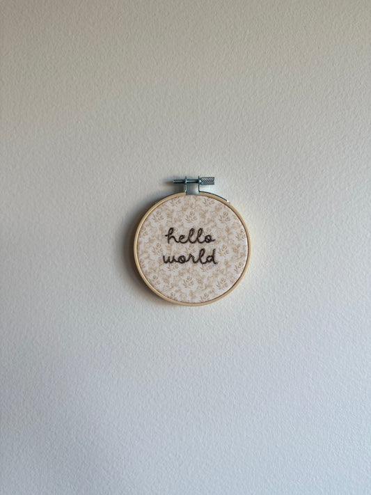 Neutral "Hello World" Embroidered Announcement