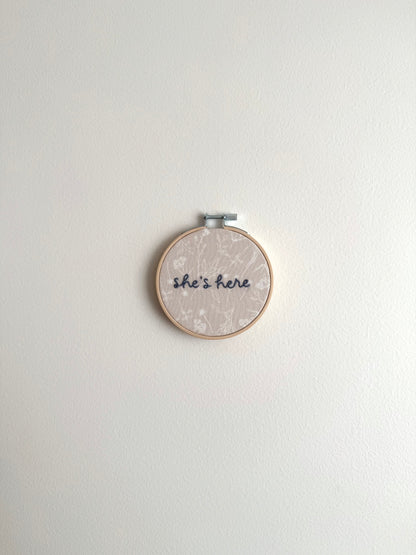 Neutral Floral "She's Here" Embroidered Announcement