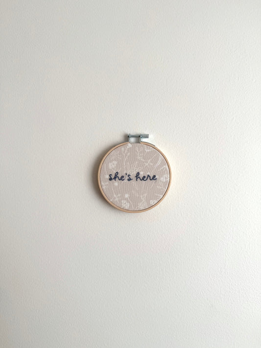 Neutral Floral "She's Here" Embroidered Announcement