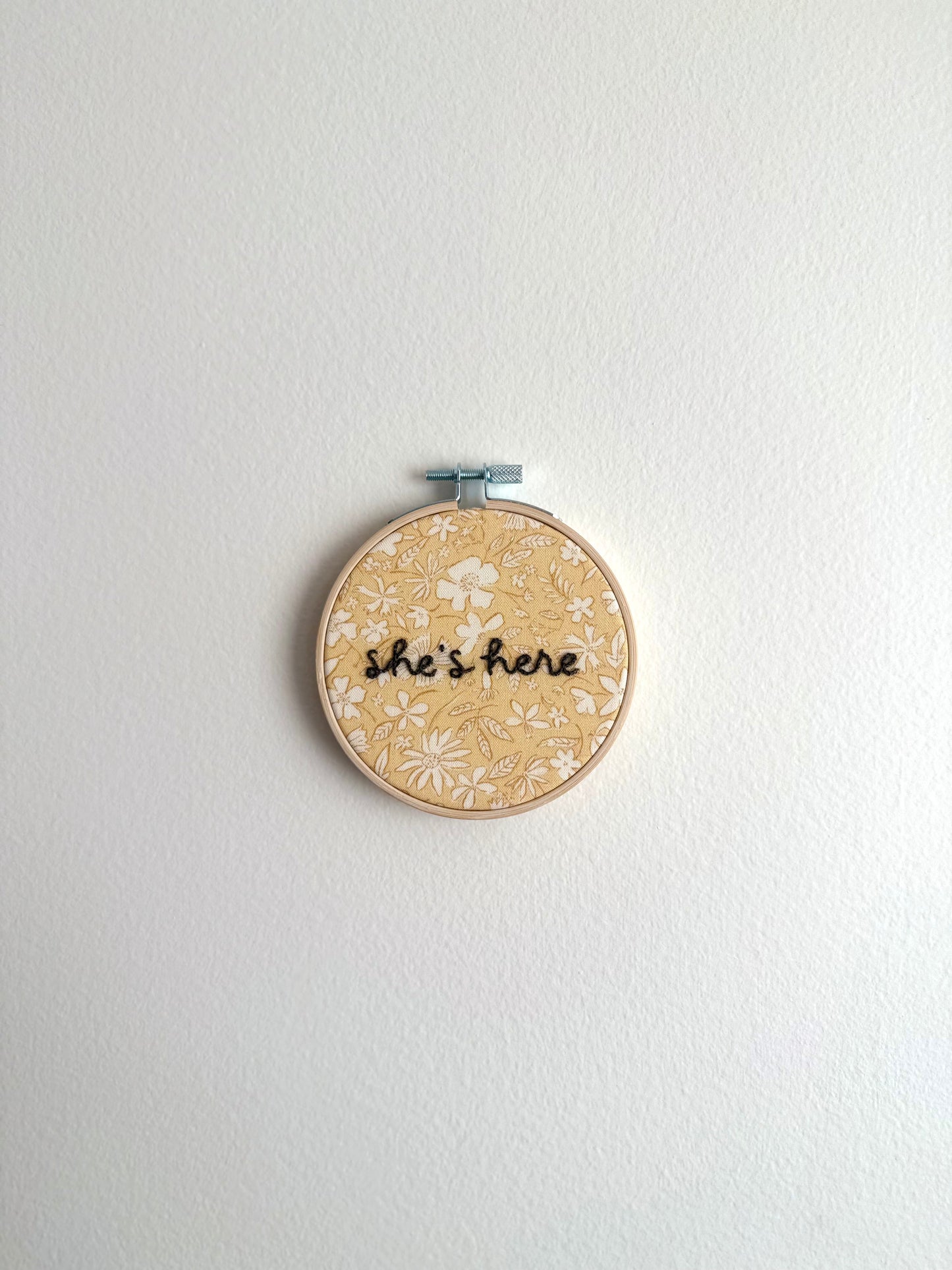 Yellow Floral "She's Here" Embroidered Announcement
